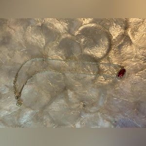 Kendra Scott Elisa- gold with berry red gem.